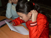 A child with poor eyesight taking part in the 'Pen Pals' Project